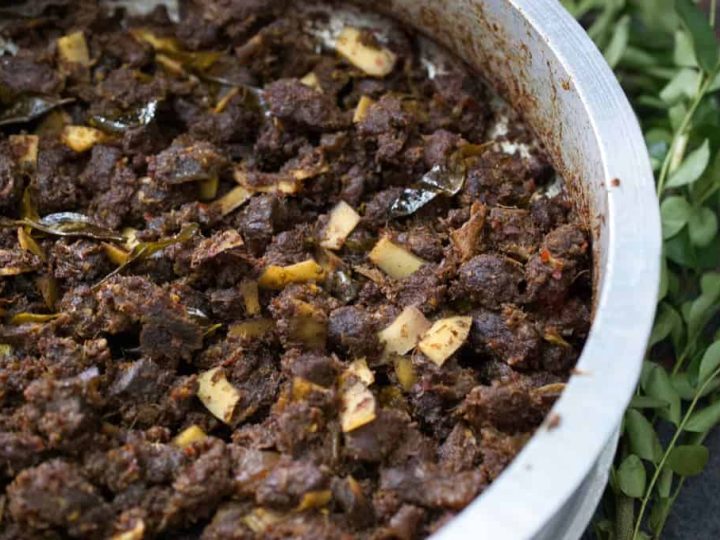 Beef cooked with spices and then stir-fried with coconut slices and curry leaves. This Kerala style beef fry / Beef Ularthiyathu is an easy and delicious appetizer or a great side-dish with rice. Beef Varattiyathu is one of the favorite dishes of Malayalees. An excellent touching for alcohol too