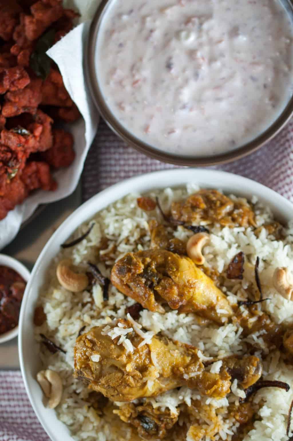 Chicken marinated and cooked with spices and layered with rice. Nadan chicken biriyani is one of my favorites. An easy, tasty and delicious Kerala style chicken biriyani recipe.An Indian one pot meal. This recipe is originated from Malabar region of Kerala.