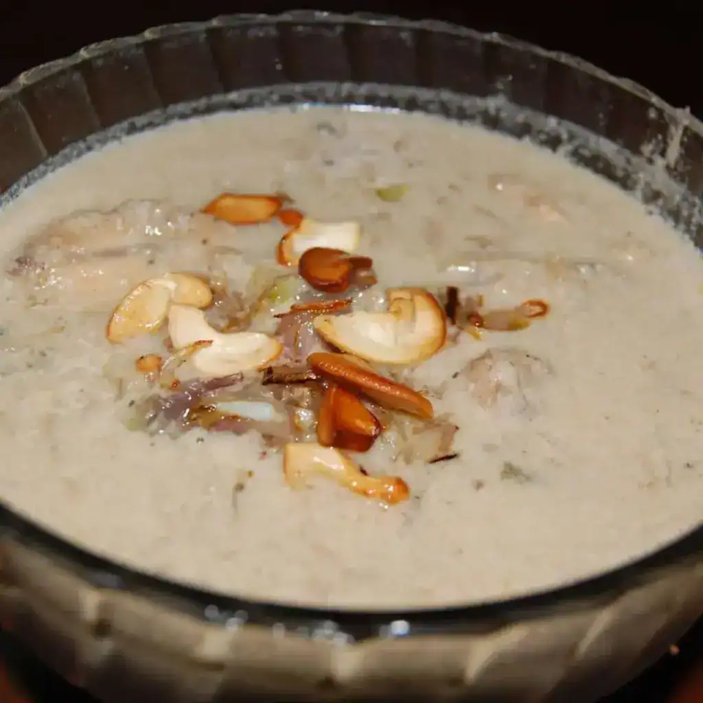 Kerala-style chicken stew or nadan kozhi ishtu served creamy with fried onions and cashews on top.
