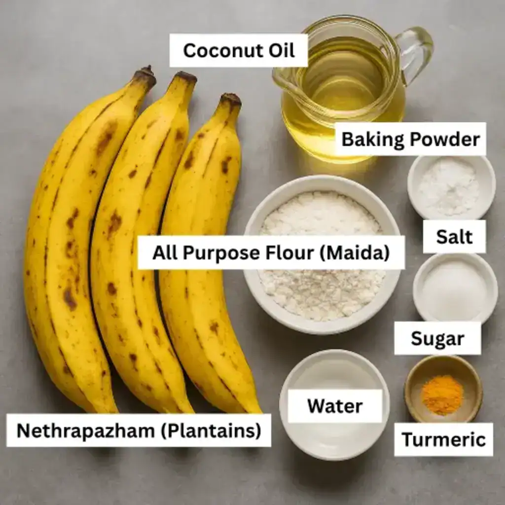 Ingredients for making Kerala banana fritters including Nethrapazham, maida, sugar, baking powder, salt, water, turmeric, and coconut oil.