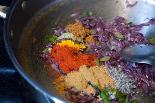 Chili, coriander, turmeric, and garam masala are added for Kerala Style Pork Fry.