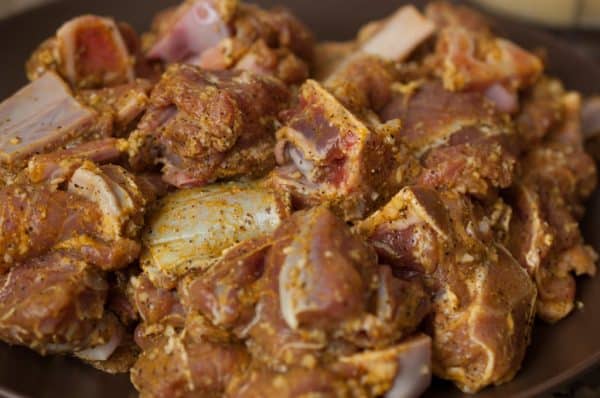 Marinated Nadan Mutton pieces seasoned with spices.