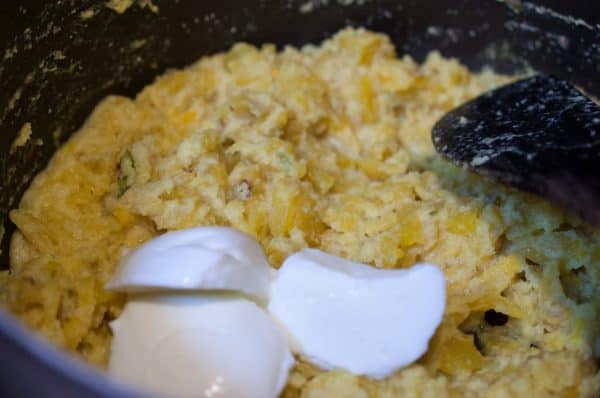 Thick yogurt added to cooked pineapple and coconut mix for Kerala-style pachadi.