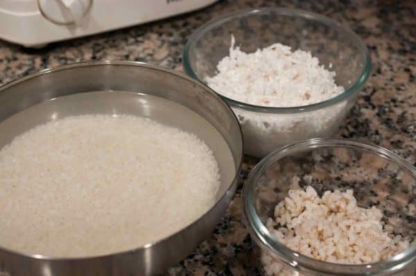Ingredients for Kerala Style Appam, including soaked raw rice, grated coconut, and boiled rice in bowls.