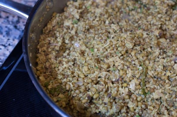 Green gram, coconut, and spices are mixed and sautéed to finish Kerala Style Green Gram stir-fry (Cherupayar thoran).