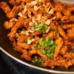 Chicken strips marinated, fried and sauteed in a spicy and tangy sauce. Quick and delicious Indo Chinese dish.