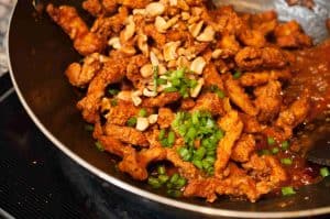 Chicken strips marinated, fried and sauteed in a spicy and tangy sauce. Quick and delicious Indo Chinese dish.