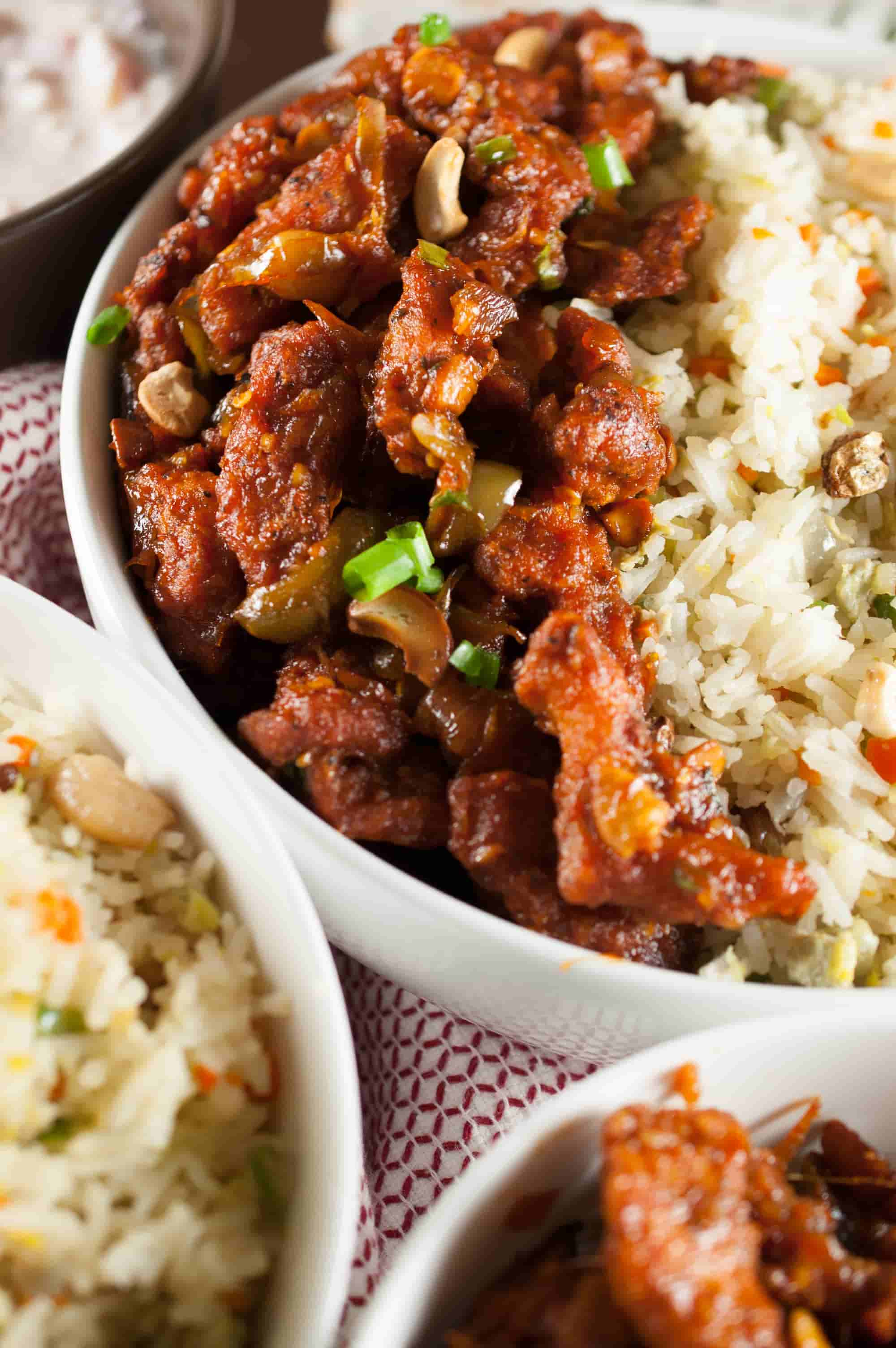 Chicken strips marinated, fried and sauteed in a spicy and tangy sauce. Quick and delicious Indo Chinese Dragon chicken recipe.