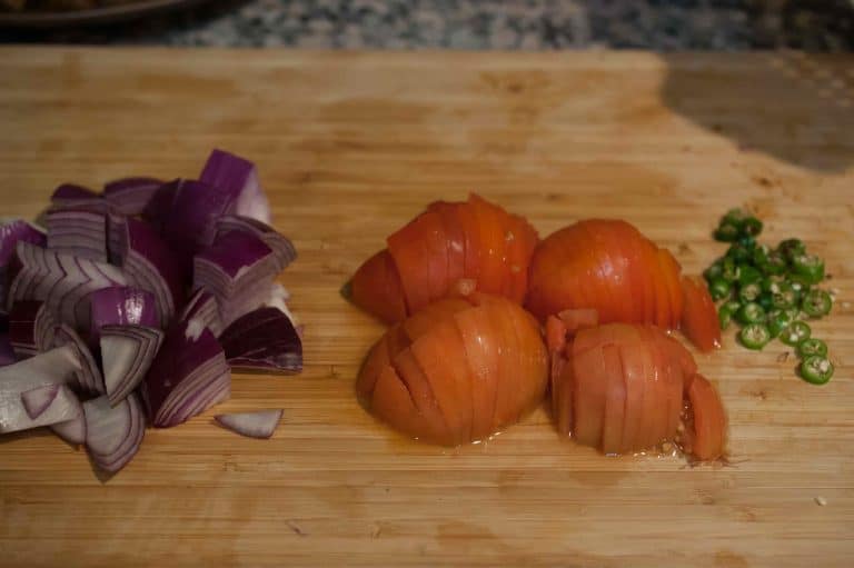 A blend of onion, tomato, and green chilly with yogurt. An easy, simple and yummy side dish to go with biriyani, pulao and any other Indian rice preparations.