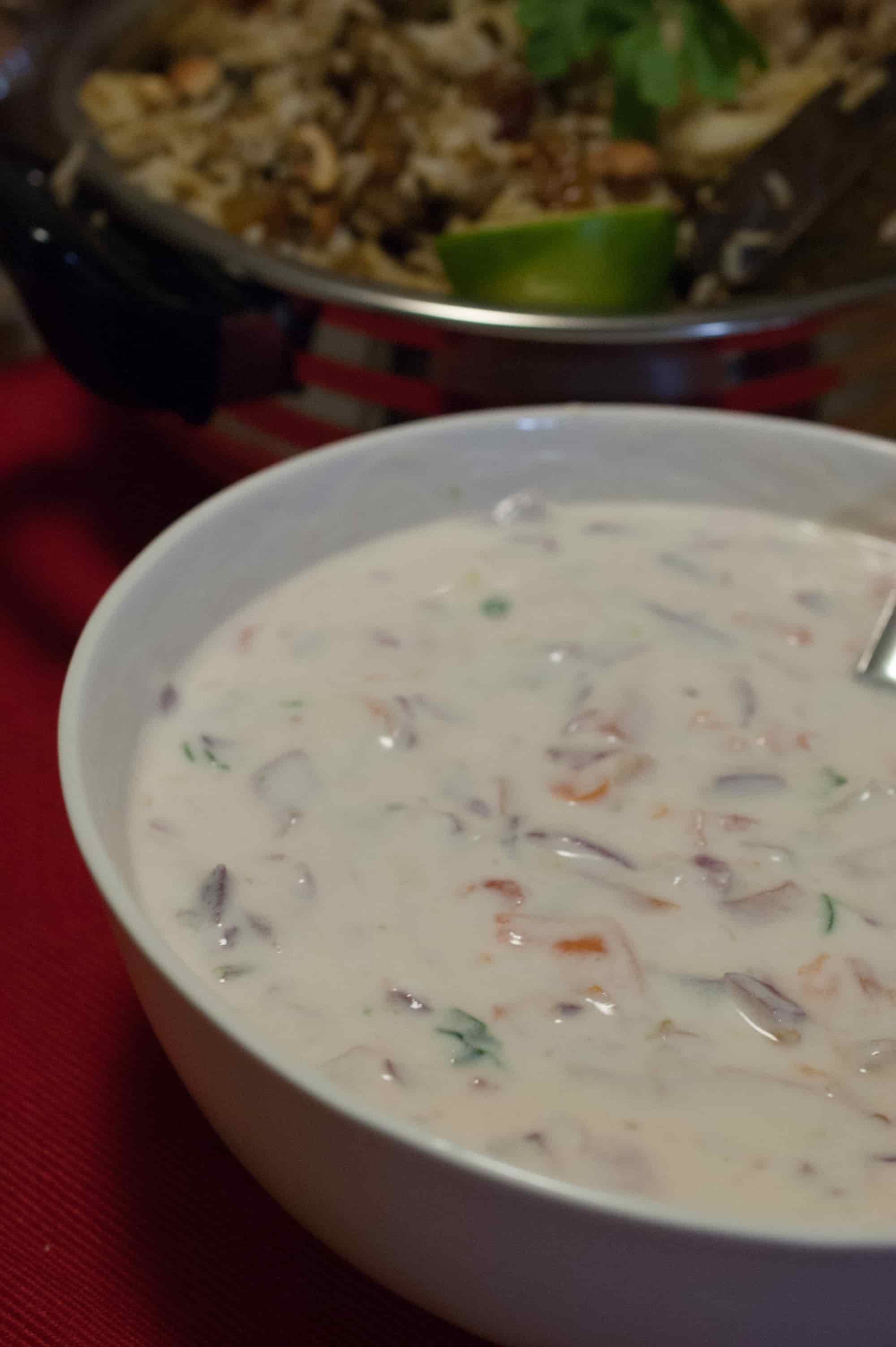 A blend of onion, tomato, and green chilly with yogurt. An easy, simple and yummy side dish to go with biriyani, pulao and any other Indian rice preparations.