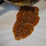 Crunchy cashew nut sprinkle. Cashew nuts toasted, mixed in caramel and then crumbled. Caramelized Cashew nut is great as topping on desserts or along with granola for breakfast.