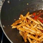 Honey Chilli Potato is a popular Indo-Chinese appetizer. Crispy Fried Potatoes cooked with spring onion and bell peppers in a sweet and spicy sauce.