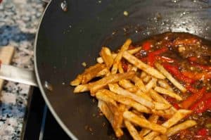 Honey Chilli Potato is a popular Indo-Chinese appetizer. Crispy Fried Potatoes cooked with spring onion and bell peppers in a sweet and spicy sauce.