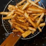 Honey Chilli Potato is a popular Indo-Chinese appetizer. Crispy Fried Potatoes cooked with spring onion and bell peppers in a sweet and spicy sauce.