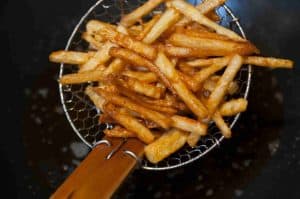 Honey Chilli Potato is a popular Indo-Chinese appetizer. Crispy Fried Potatoes cooked with spring onion and bell peppers in a sweet and spicy sauce.