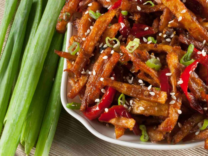 Honey Chilli Potato is a popular Indo-Chinese appetizer. Crispy Fried Potatoes cooked with spring onion and bell peppers in a sweet and spicy sauce.