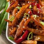 Honey Chilli Potato is a popular Indo-Chinese appetizer. Crispy Fried Potatoes cooked with spring onion and bell peppers in a sweet and spicy sauce.