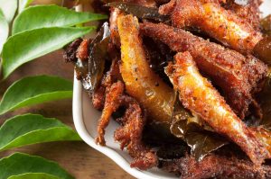 Crispy and spicy Anchovy or Kozhuva or Netholi fry. Anchovies marinated with spices and then shallow fried. A quite easy and tasty appetizer.