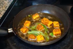 Indian cottage cheese / Paneer shallow fried with ginger-garlic, spices, and curry leaves. This paneer fry is an easy and yummy appetizer for any occasions.