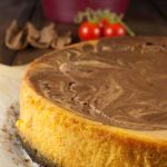 Pumpkin chocolate swirl cheesecake with oreo crust which is rich, delicious and has an amazing pumpkin pie spice flavor. Melted Chocolate chips swirled into pumpkin cheesecake mixture gives it a marbled effect.