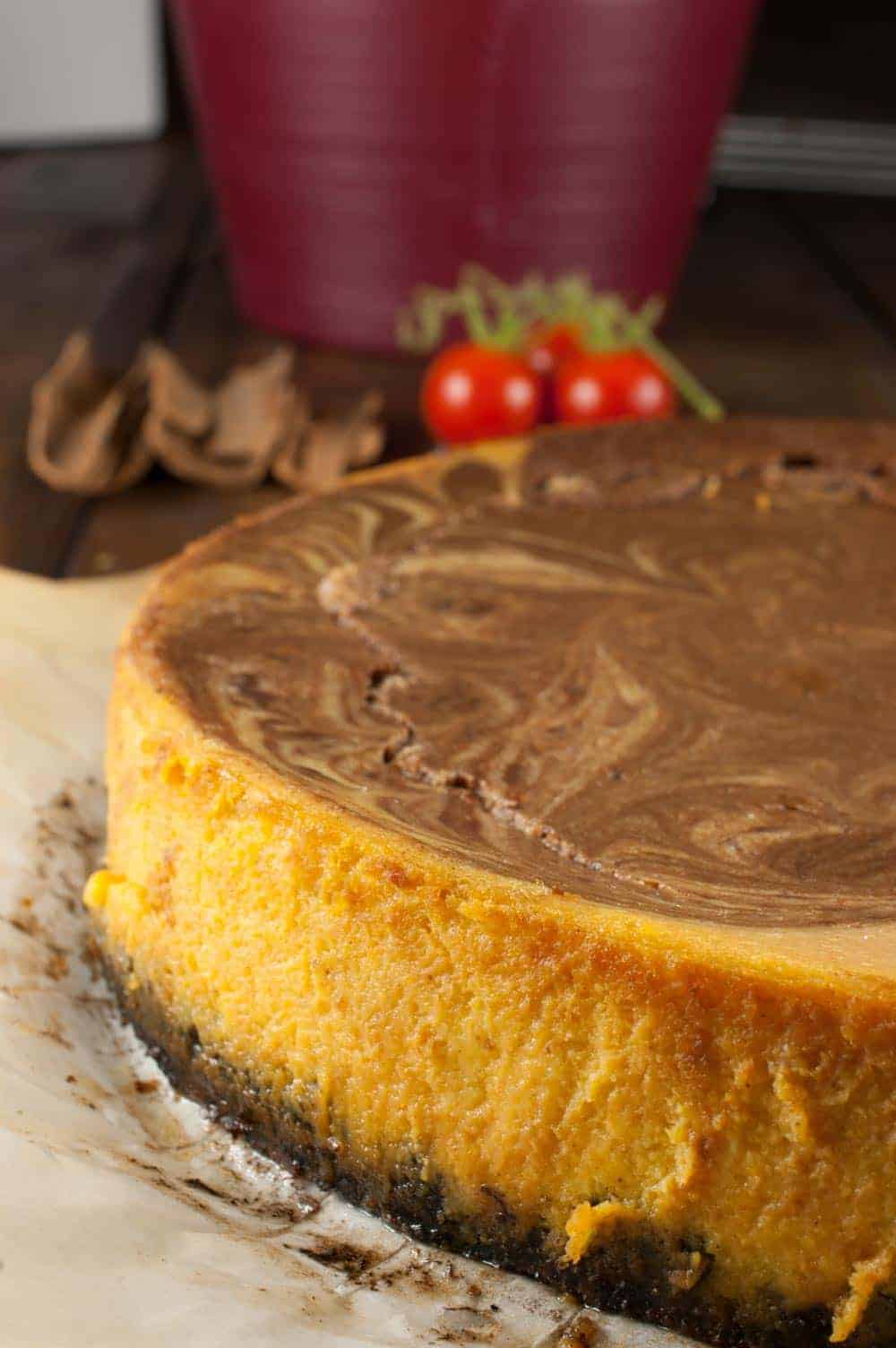 Pumpkin chocolate swirl cheesecake with oreo crust which is rich, delicious and has an amazing pumpkin pie spice flavor. Melted Chocolate chips swirled into pumpkin cheesecake mixture gives it a marbled effect.