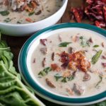 Spicy Italian sausage, fresh leaves, and potatoes in a creamy broth topped with crumbled bacon. An easy and yummy Olive Garden Zuppa Toscana Soup recipe.