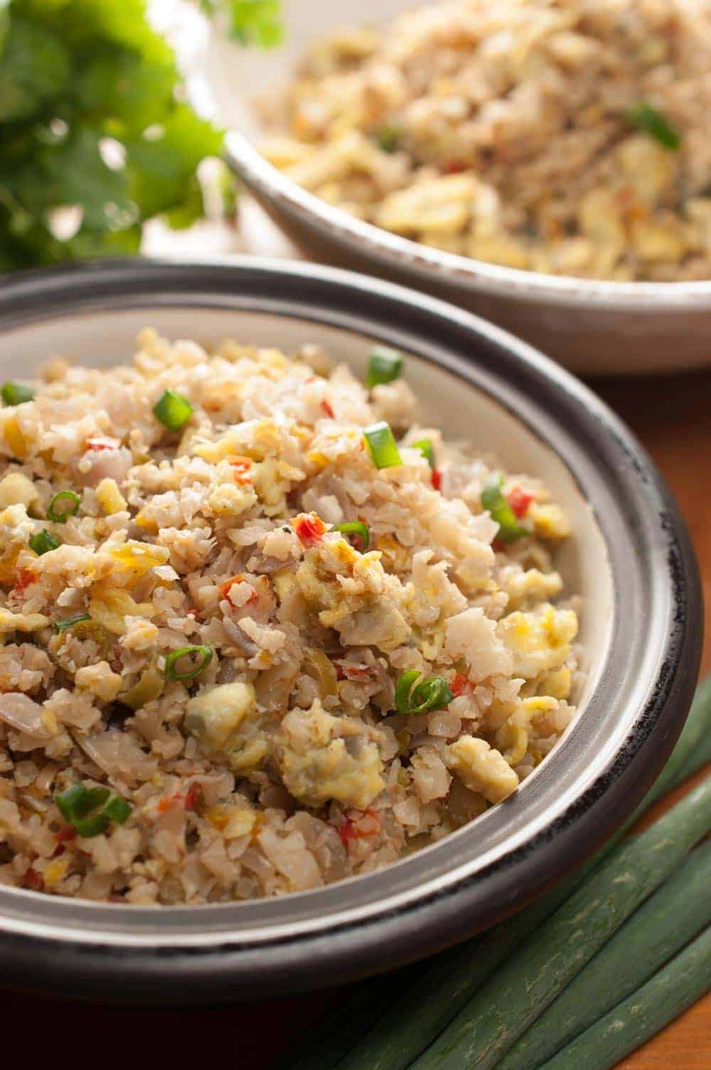 Cauliflower rice cooked with onion, bell peppers, and eggs. This cauliflower rice stir fry with eggs is an easy and healthy recipe without compromising the taste. One of the best ways to make cauliflower rice. This works out well for Paleo/Gluten-free/Keto lifestyle.