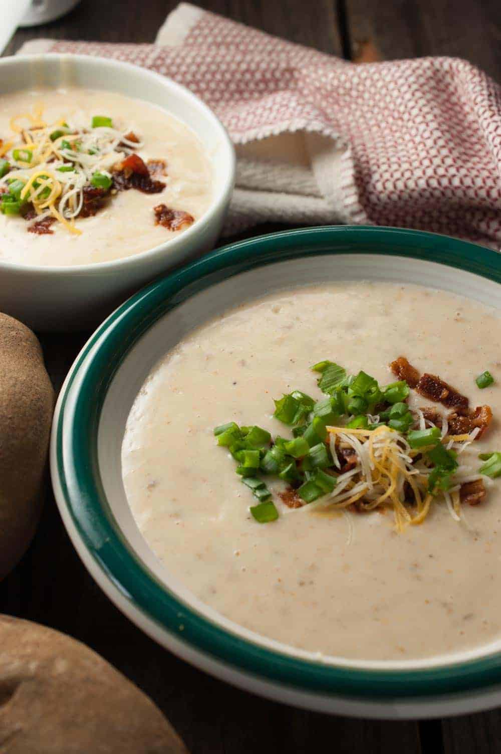 Potatoes pressure cooked, blended with cream cheese and topped with green onions, cheese, and bacon. This Instant Pot Easy Creamy Potato Soup is a healthy One Pot Soup and one of my favorites for dinner, especially during winter time.