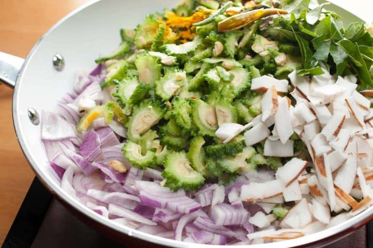 Bittergourd stir-fried with onion, thin coconut pieces, and spices. In Kerala, this dish is popular as Pavakka Mezhukkupuratti. This Bitter Gourd Fry is a quick and healthy side dish that goes along with rice.