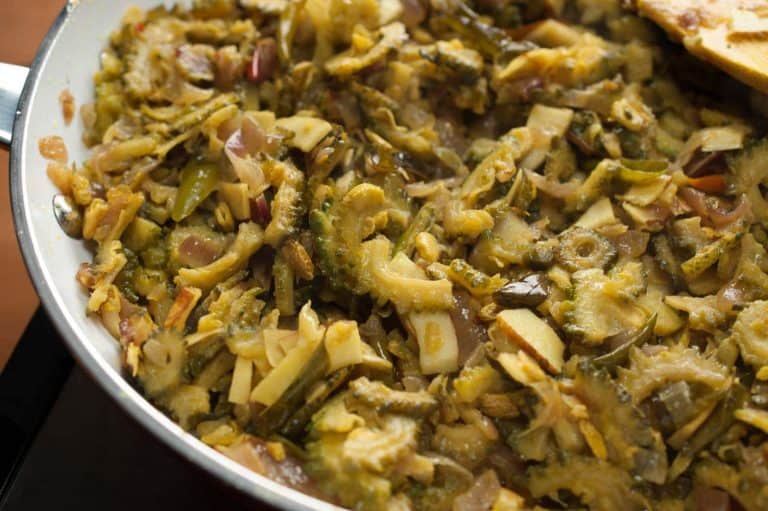 Bitter gourd stir-fried with onion, thin coconut pieces, and spices. In Kerala, this dish is popular as Pavakka Mezhukkupuratti. This Bitter Gourd Fry / Karela Fry is a quick and healthy side dish that goes along with rice.