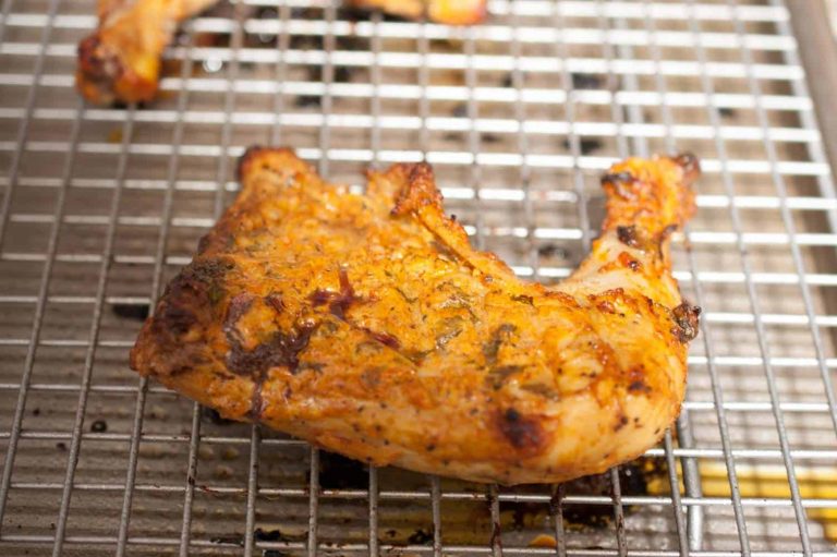 Chicken marinated in yogurt and spices and then baked in an oven. This Indian Tandoori Chicken In Oven recipe is straightforward to make at home with minimal ingredients