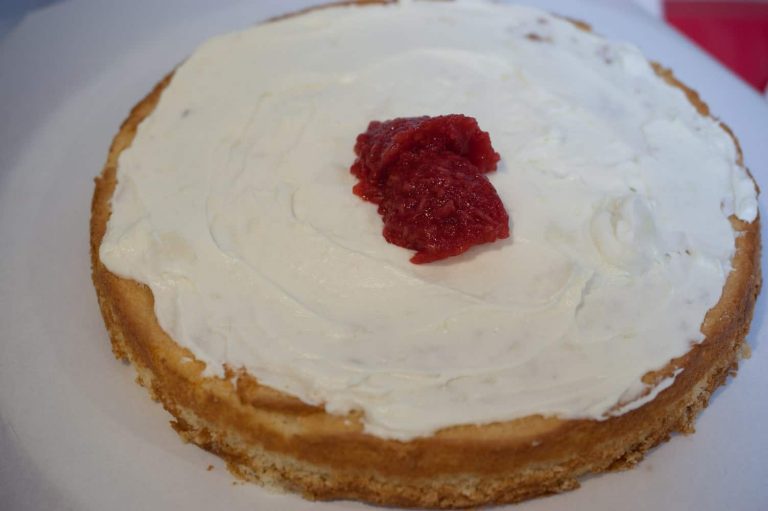 Moist and rich white chocolate cake with white chocolate cream cheese and raspberry filling, and frosted with white chocolate ganache. The white chocolate cake is our family favorite cake recipe, and I went with the same flavor for my daughter Eva's first birthday cake.