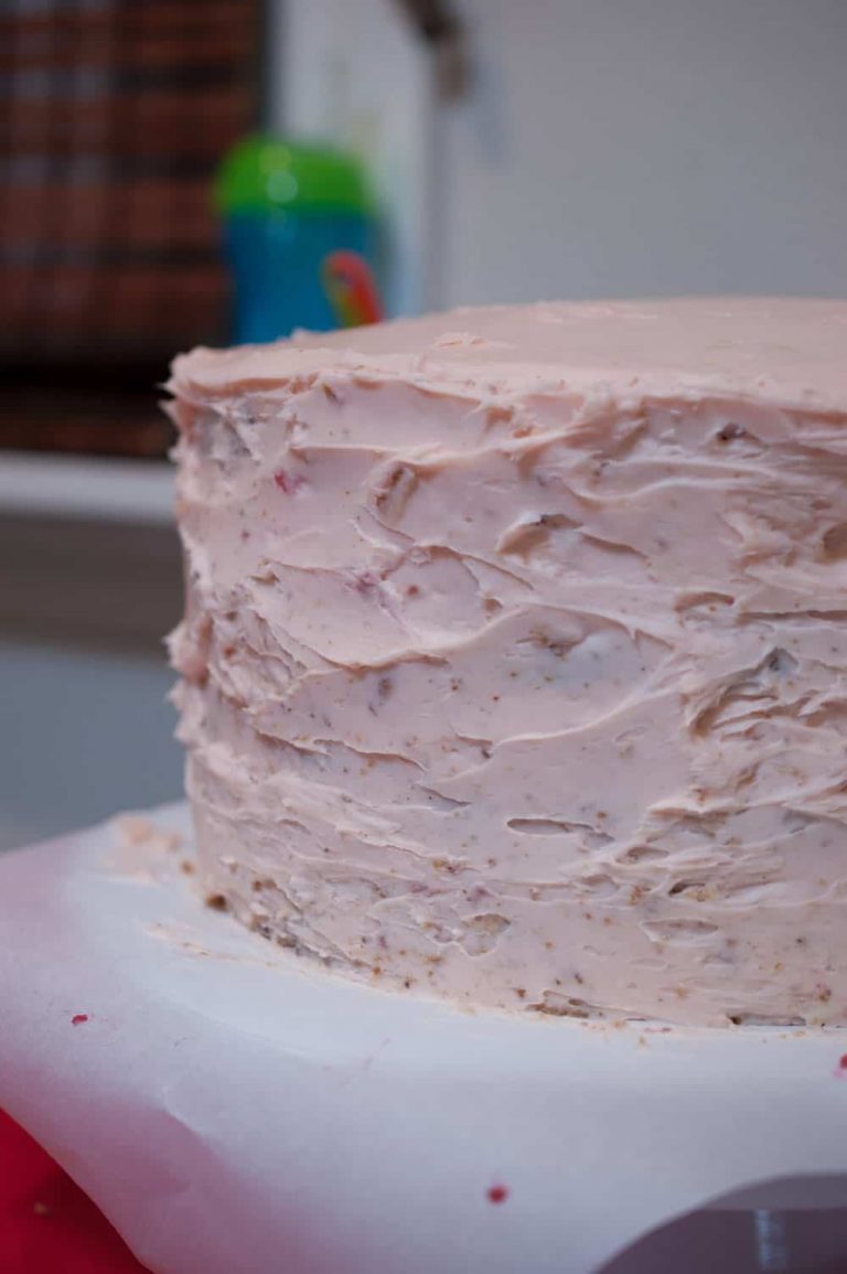 Moist and rich white chocolate cake with white chocolate cream cheese and raspberry filling, and frosted with white chocolate ganache. The white chocolate cake is our family favorite cake recipe, and I went with the same flavor for my daughter Eva's first birthday cake.