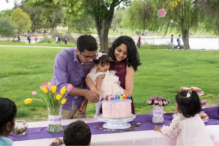 Moist and rich white chocolate cake with white chocolate cream cheese and raspberry filling, and frosted with white chocolate ganache. The white chocolate cake is our family favorite cake recipe, and I went with the same flavor for my daughter Eva's first birthday cake.