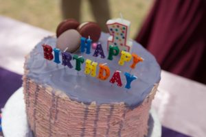 Moist and rich white chocolate cake with white chocolate cream cheese and raspberry filling, and frosted with white chocolate ganache. The white chocolate cake is our family favorite cake recipe, and I went with the same flavor for my daughter Eva's first birthday cake.