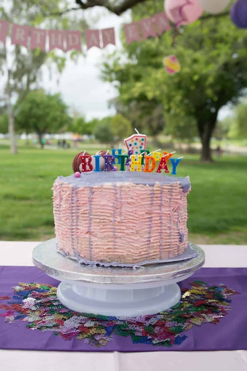 Moist and rich white chocolate cake with white chocolate cream cheese and raspberry filling, and frosted with white chocolate ganache. The white chocolate cake is our family favorite cake recipe, and I went with the same flavor for my daughter Eva's first birthday cake.