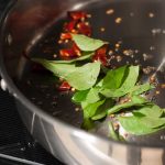 Kerala style beans stir fry with spices, ginger, and garlic. This Beans Mezhukkupuratti or Beans Olathiyathu is a quick and healthy side dish that goes well with rice.