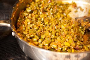 Kerala style beans stir fry with spices, ginger, and garlic. This Beans Mezhukkupuratti or Beans Olathiyathu is a quick and healthy side dish that goes well with rice.