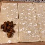 This is an image of puff pastry sheet cut into squares