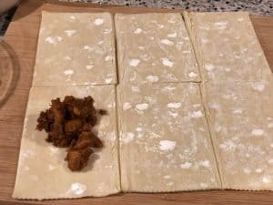 This is an image of puff pastry sheet cut into squares