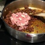 this is an image of chopped chicken added to sauteed masala