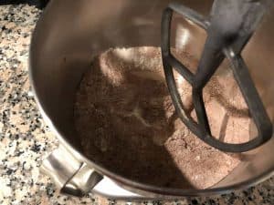 Combine the dry ingredients - Sift together flour, sugar, cocoa, baking soda, baking powder, and salt into the bowl of a stand mixer