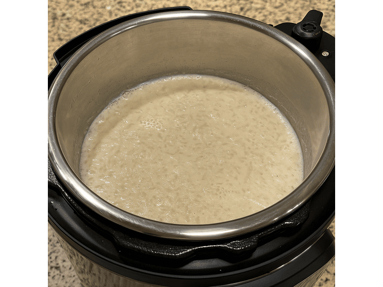Roasted ada added into boiling milk and cooked under pressure in an Instant Pot for Palada Payasam.