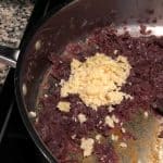 While making the masala for puff pastry, saute onion, curry leaves and salt until onion turns lightly brown. Then, add ginger and garlic.