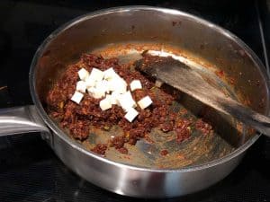 While making the masala for puff pastry, once onion and the masalas are sauteed, add chopped paneer pieces