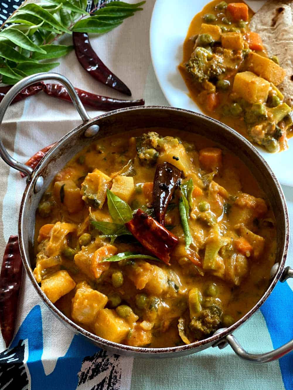 Mixed vegetable curry with coconut milk served with chapathi