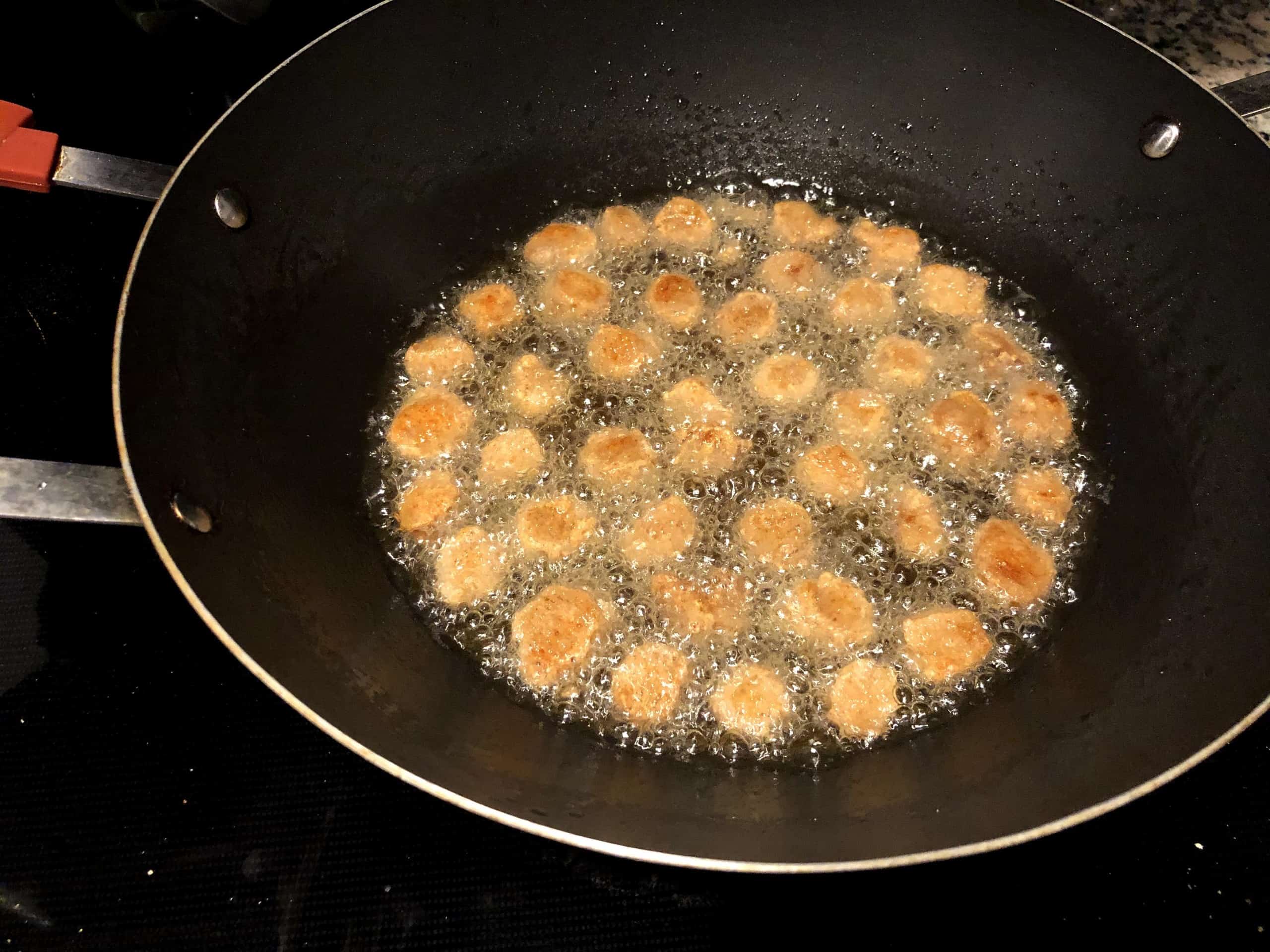 Deep fry the marinated soya chunks/meal maker pieces until golden brown.